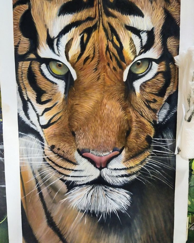 "Hyper-realistic tiger face tattoo artwork showcasing fine detail and expert shading by a professional tattoo artist in Hyderabad."